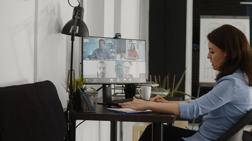 Side view of man working at home