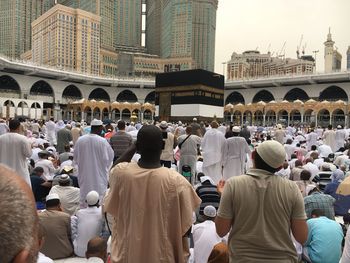 Group of people in front of buildings in city