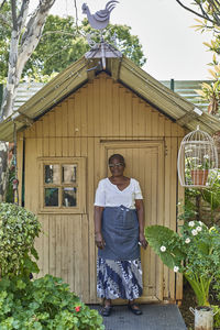 Portrait of a senior woman at garden shed