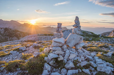 Scenic view of snowcapped mountains against sky during sunset