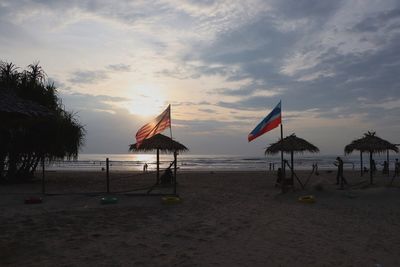 Scenic view of beach against sky during sunset
