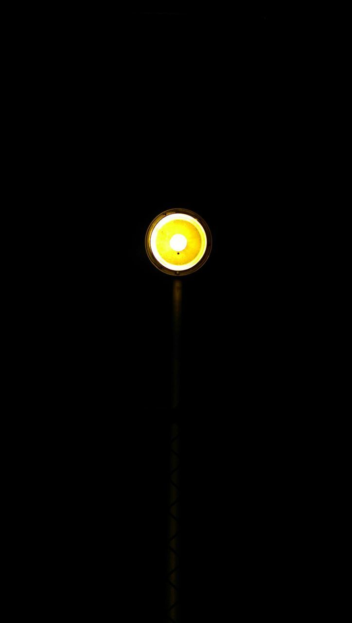 illuminated, night, copy space, lighting equipment, dark, electricity, circle, glowing, electric light, light - natural phenomenon, street light, low angle view, electric lamp, no people, yellow, clear sky, light, lamp, lit, tunnel