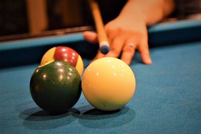 Close-up of person hand on table