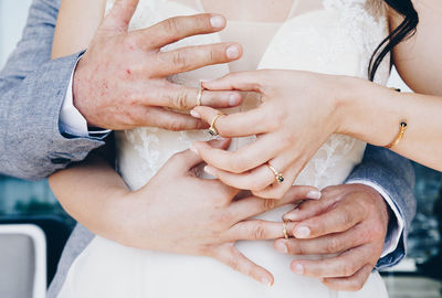 Close-up of couple holding hands