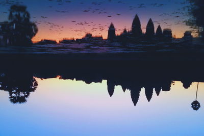 Silhouette of temple against sky during sunset