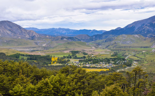 Scenic view of landscape and mountains against sky