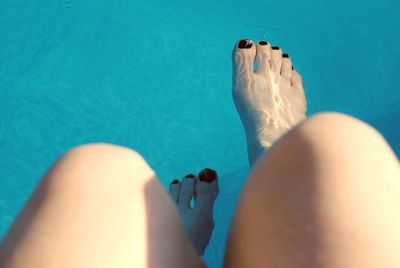 Low section of woman in swimming pool