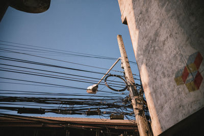 Low angle view of cables against sky