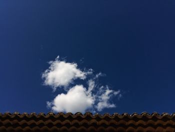 Low angle view of roof and building against sky