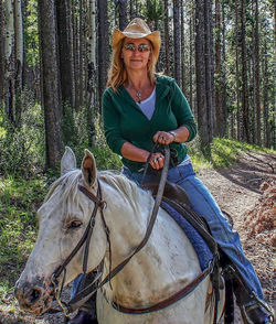 Portrait of smiling woman in forest