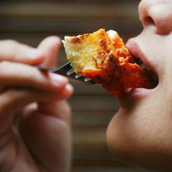 Close-up of woman eating food