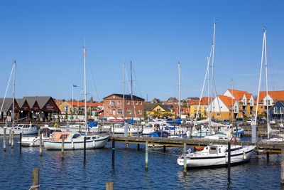 Boats moored at harbor