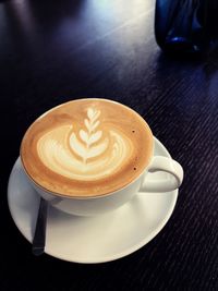 High angle view of cappuccino on table