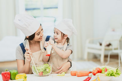 Midsection of woman preparing food