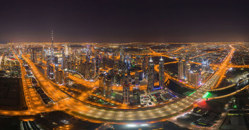 High angle view of illuminated buildings in city at night