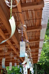 Low angle view of decorations hanging on ceiling of building