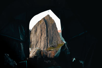 Midsection of man standing in tunnel