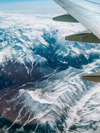 Aerial view of sea and snowcapped mountain