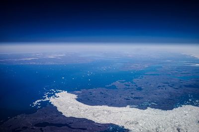 Scenic view of sea against blue sky