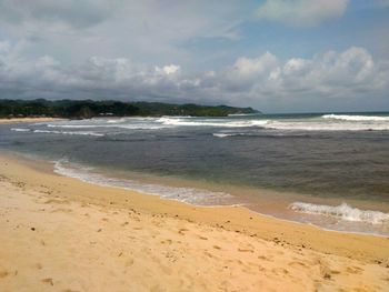 Scenic view of beach against sky