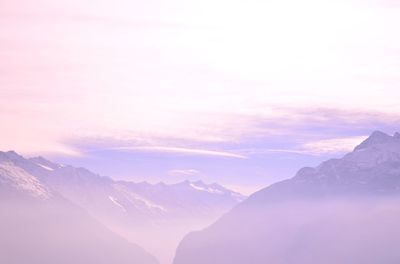 Scenic view of mountains against sky during sunset