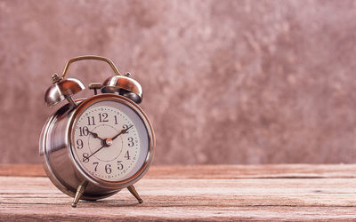 Close-up of clock on table
