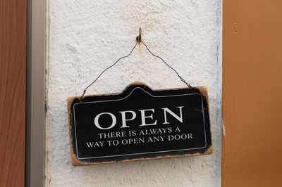 Close-up of information sign on wall