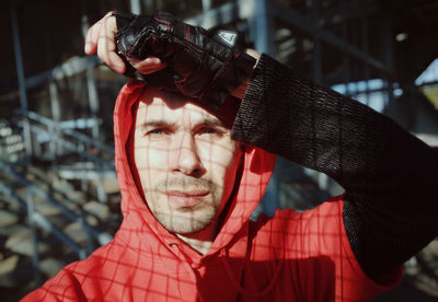 Portrait of young man holding camera