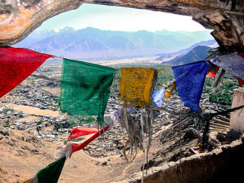 Clothes drying on mountain against sky