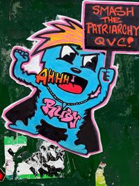 Close-up of graffiti on wall