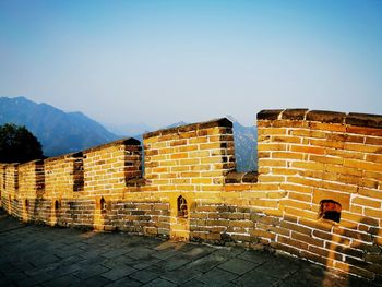 Brick wall against clear sky