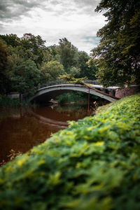 Bridge over canal against sky