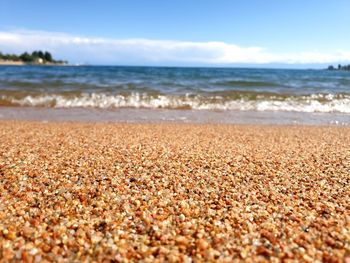 Surface level of beach against sky