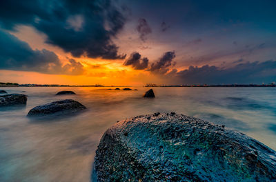 Scenic view of sea against sky during sunset