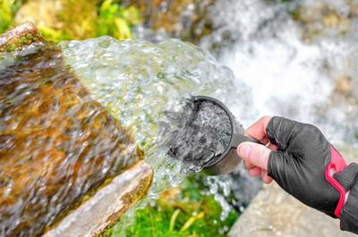 Refreshment with cold clean water on hot summer day. the flow of clean water from source. 