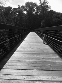 Footbridge leading to wooden bridge