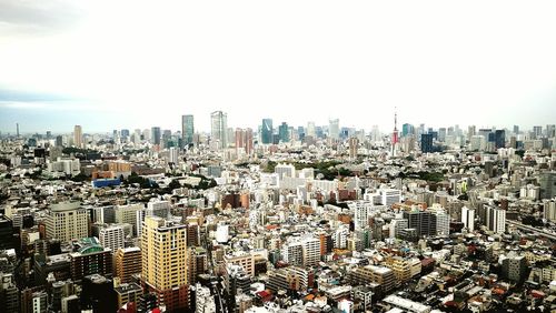 Aerial view of cityscape against sky