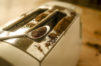 Close-up of ground coffee on toaster