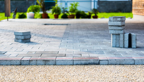 Sand and paving stones on land