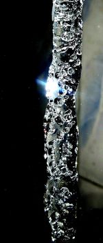 Close-up of water against black background