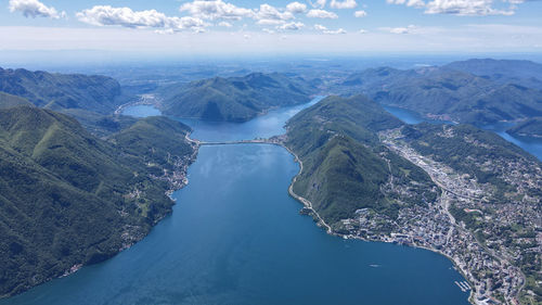 High angle view lugano of sea and mountains against sky