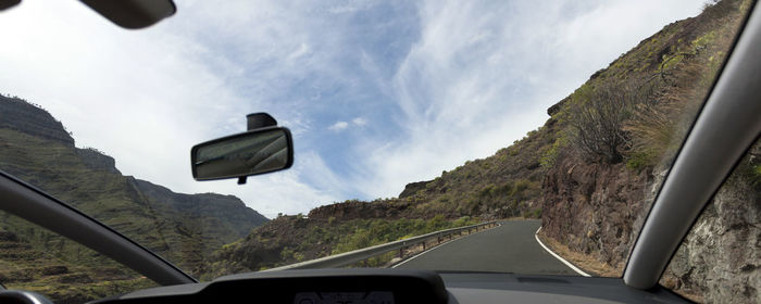 View of road against cloudy sky