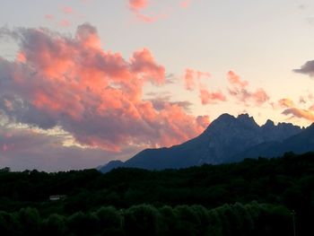 Scenic view of mountains against sky at sunset