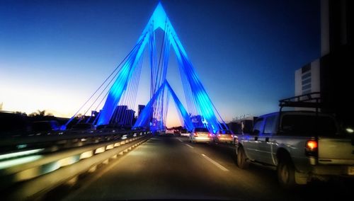 View of suspension bridge at night