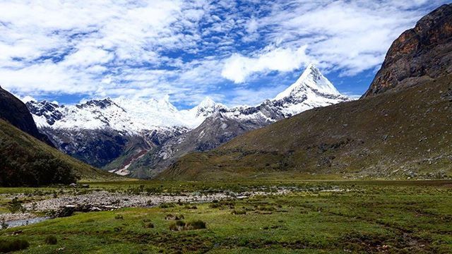 mountain, mountain range, tranquil scene, scenics, sky, tranquility, landscape, beauty in nature, snowcapped mountain, snow, nature, winter, cloud - sky, non-urban scene, cold temperature, grass, cloud, idyllic, day, rocky mountains