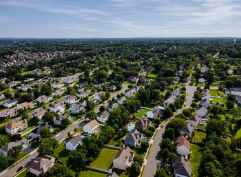 High angle view of trees and buildings against sky