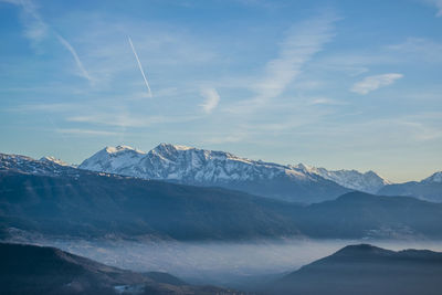 Scenic view of mountains against sky during winter