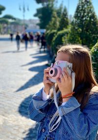 Portrait of woman photographing