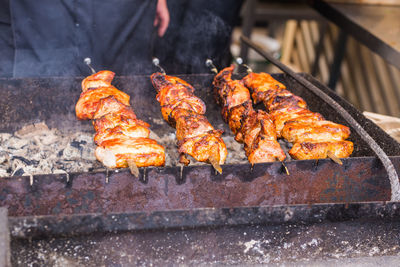 High angle view of meat on barbecue grill