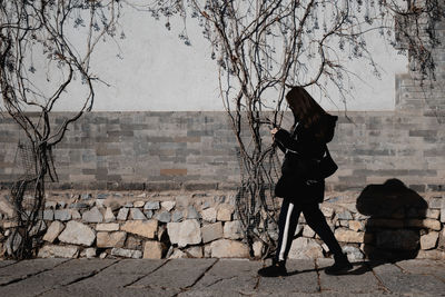 Low angle view of man walking on street